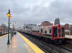 The Holiday Lights M8 Set heads away from Harlem 125th Street Station with Car # 9260 trailing